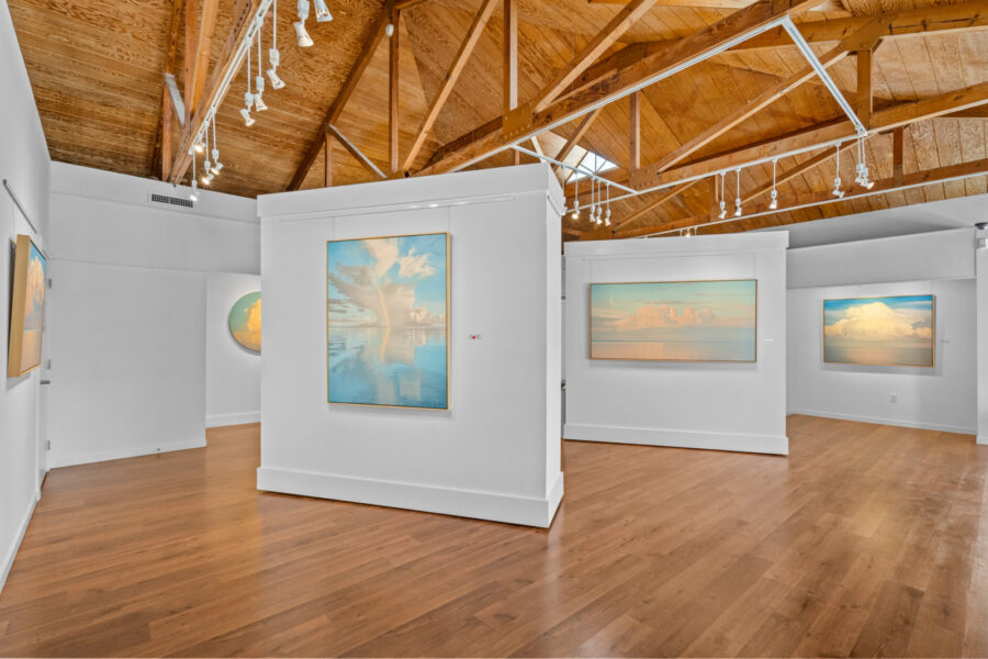 a large room with paintings on the walls