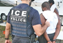 a police officer holding a child in his arms