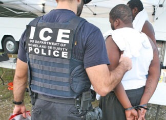 a police officer holding a child in his arms