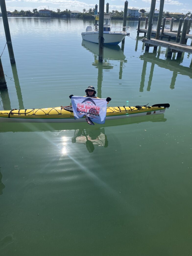 a man in a kayak in the water