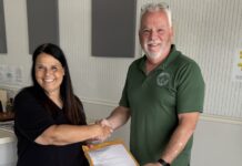 a man and a woman shaking hands in an office