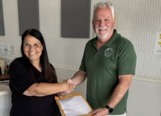 a man and a woman shaking hands in an office
