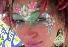 a woman with face paint on her face