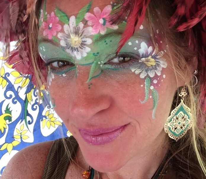 a woman with face paint on her face