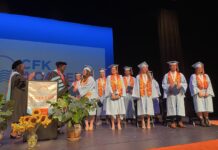 a group of people standing on top of a stage