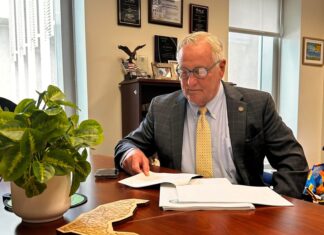 a man sitting at a desk in an office