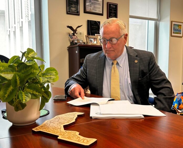 a man sitting at a desk in an office