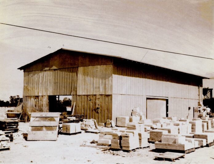 Keystone warehouse Large a black and white photo of a building with boxes in front of it