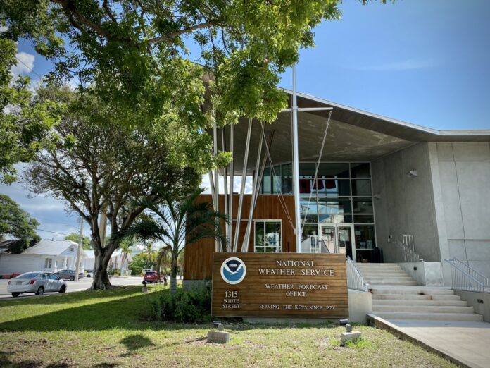 NWS office the front of a building with a flag on it