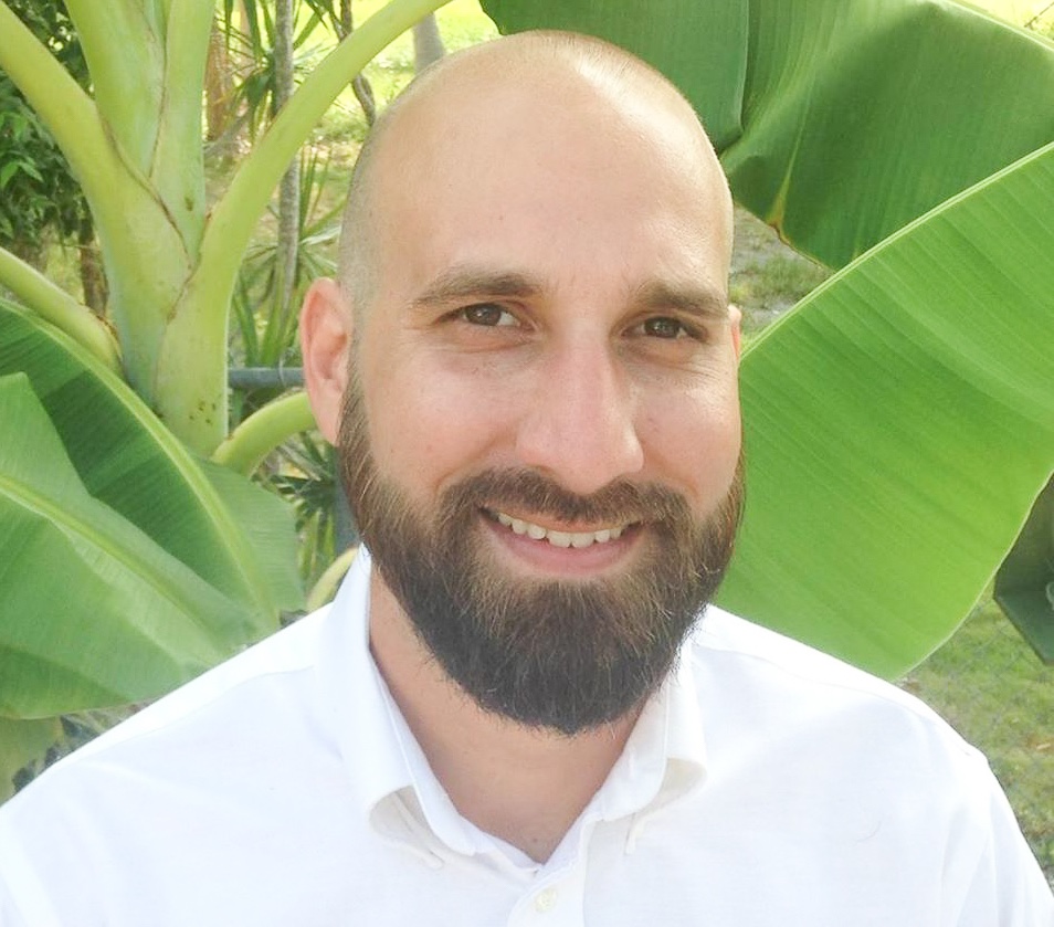 a man with a beard and a white shirt