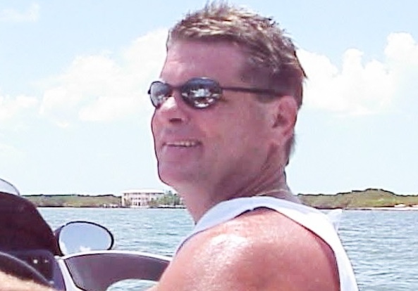 a man driving a boat in the water
