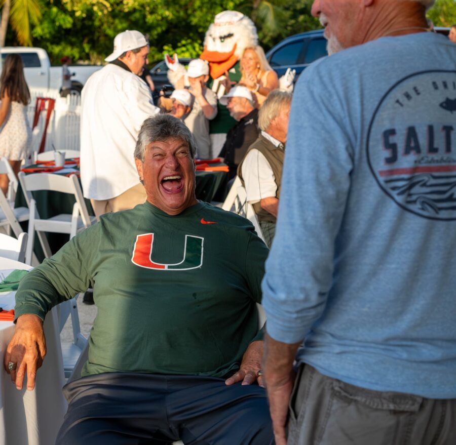 a man sitting in a chair with his mouth open