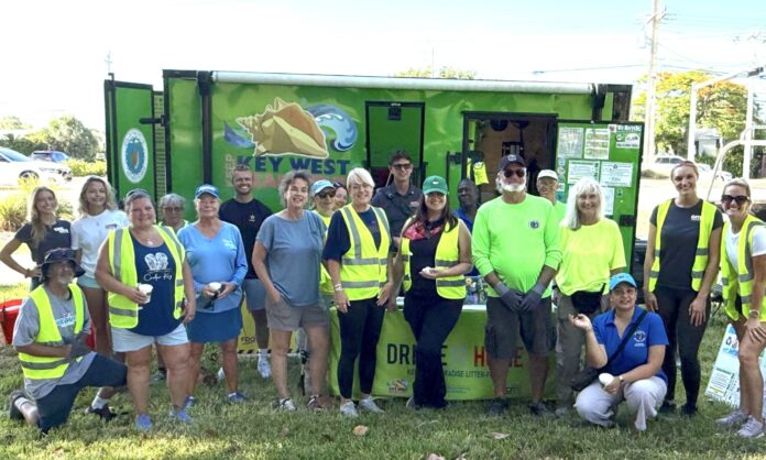 a group of people standing in front of a food truck