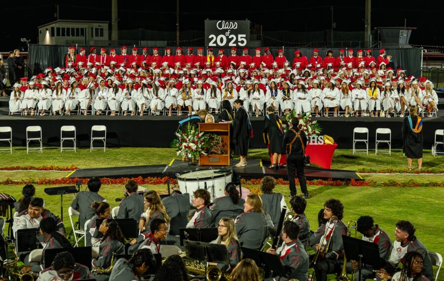 a group of people that are standing in front of a band