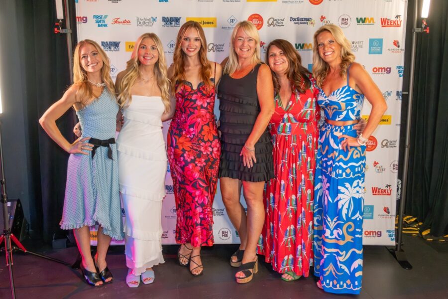a group of women standing next to each other