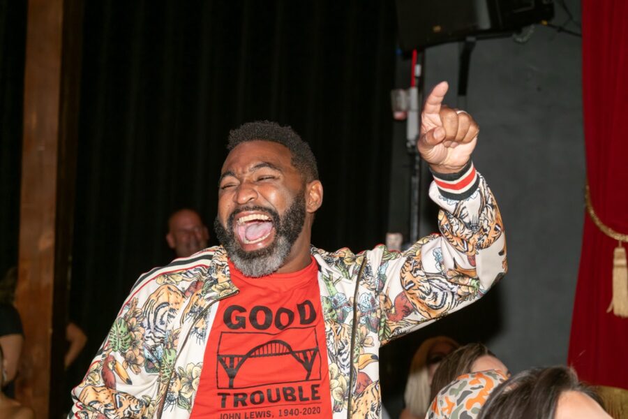 a man with a beard and a red shirt