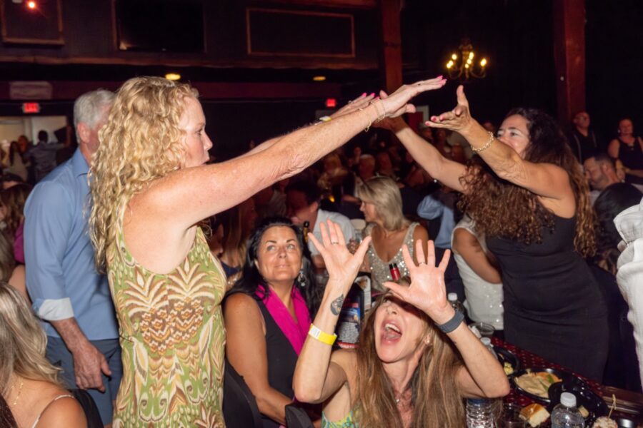 a group of people dancing at a party