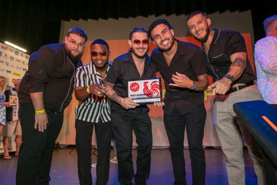 a group of men standing next to each other on a stage