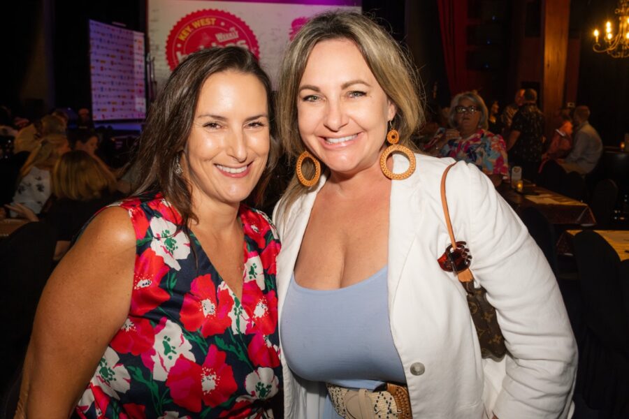 a couple of women standing next to each other