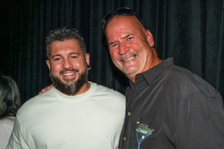 a couple of men standing next to each other