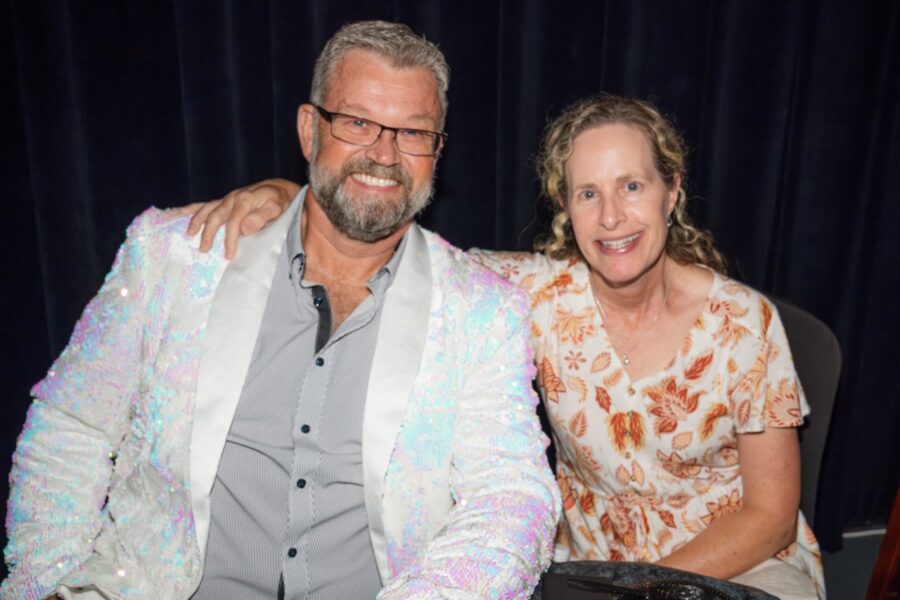 a man and a woman sitting next to each other