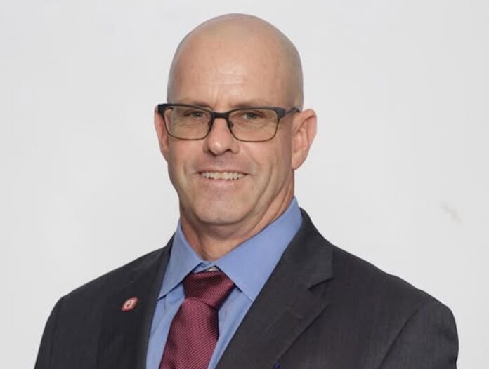 a man in a suit and tie posing for a picture