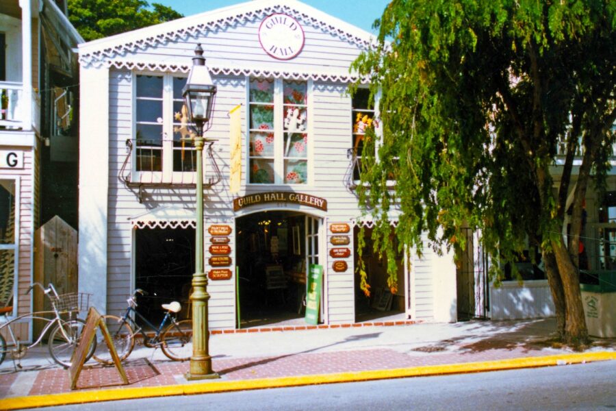a white building with a clock on the front of it