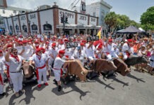 a group of people dressed in white and red