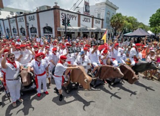 a group of people dressed in white and red