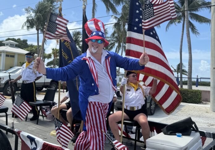 IMG_4235 2 a man in a patriotic outfit standing on a stage