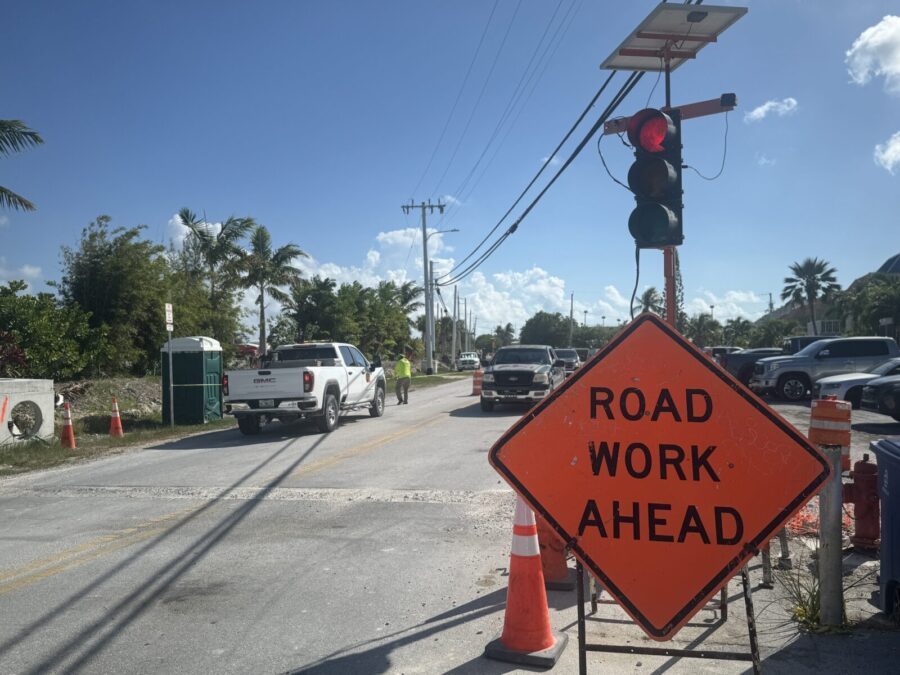 a road work ahead sign on the side of the road