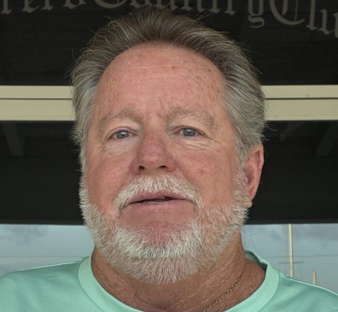 a close up of a person wearing a green shirt