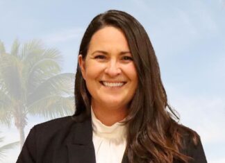a woman in a black jacket and white shirt