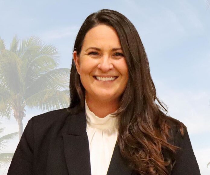 a woman in a black jacket and white shirt