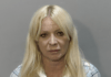 a woman with long blonde hair in a mug shot