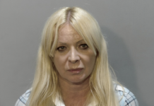 a woman with long blonde hair in a mug shot