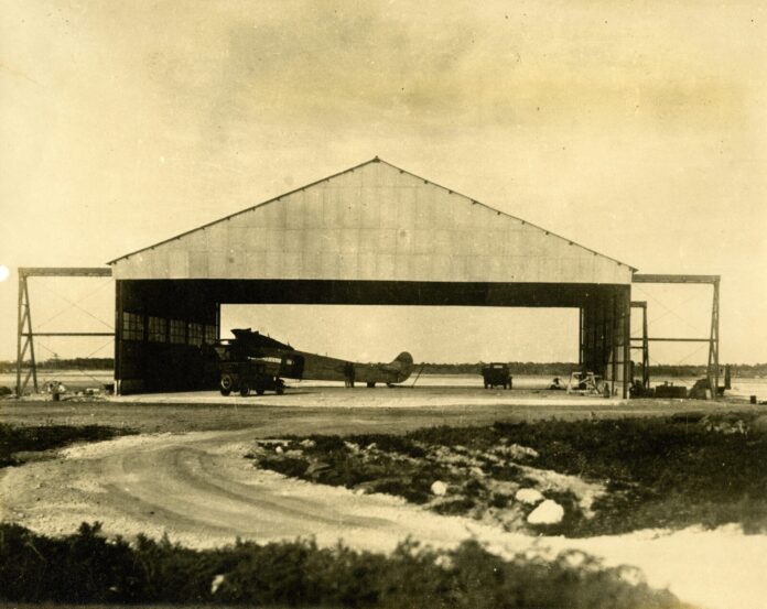 Pan Am Meacham Field an old photo of an airplane in a hangar