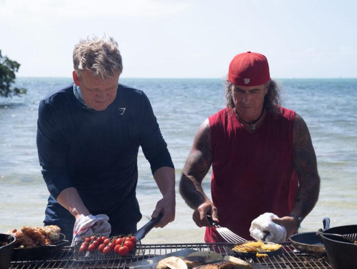 Paul Gordon a couple of men cooking on top of a grill