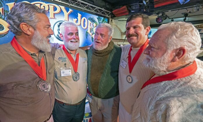 a group of men standing next to each other
