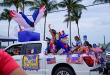a group of people riding in the back of a truck