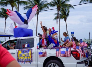 a group of people riding in the back of a truck
