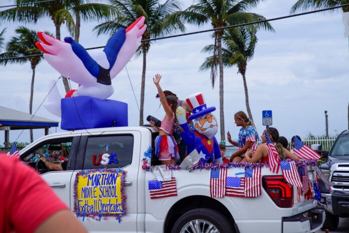 a group of people riding in the back of a truck
