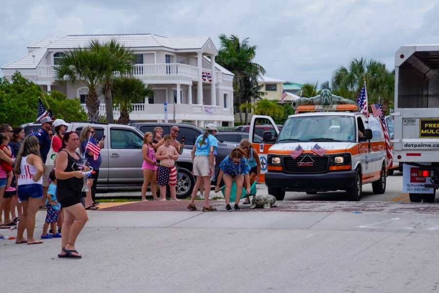 a group of people standing in front of an ambulance