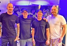 a group of men standing next to each other