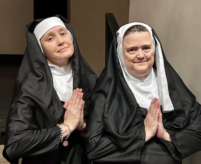a couple of women standing next to each other