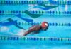 a man swimming in a swimming pool
