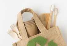 a jute bag with a recyclable symbol on it