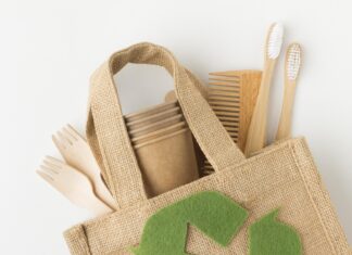 a jute bag with a recyclable symbol on it