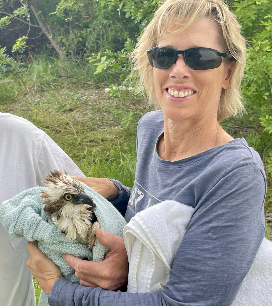 a woman holding a stuffed animal in her hands