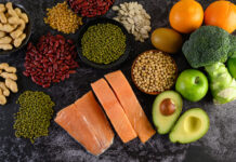 a variety of fruits and vegetables are arranged on a table